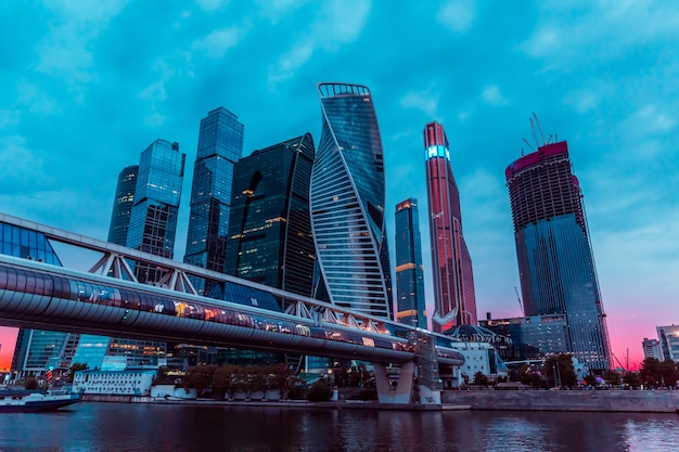 Night urban time lapse of Moscow-city downtown business center with tall buildings. Cityscape of illuminated city.