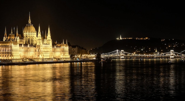 Night view of Budapest city Parliament building on left
