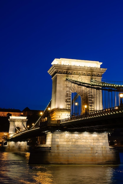 Night view of Chain bridge Royal Palace and Danube river in Budapest