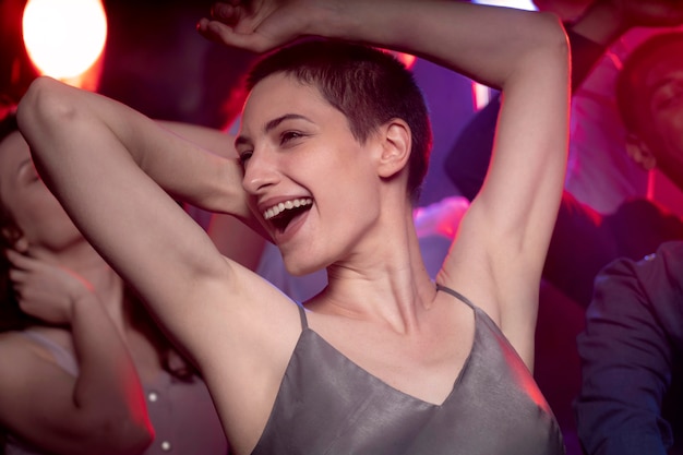 nightlife with people dancing in a club