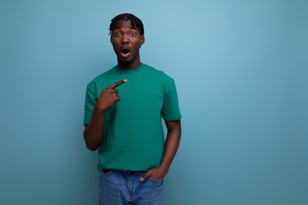 Nimble smart american young man in a tank top on an isolated background