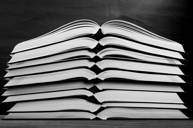 Nine open books, black and white photography