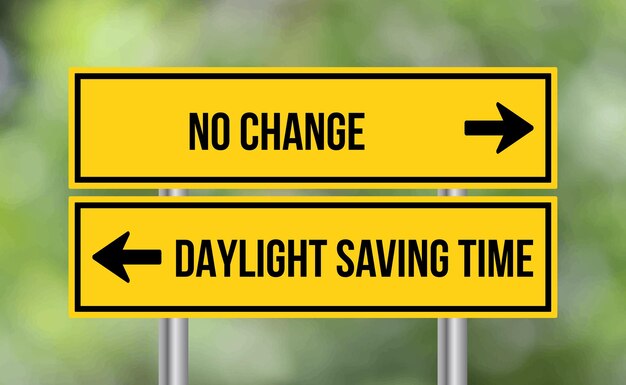 No change or daylight saving time road sign on blur background