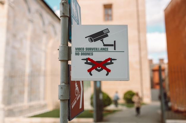 No drone zone with logo to ban drone flying in the area at city street at Italy Pisa