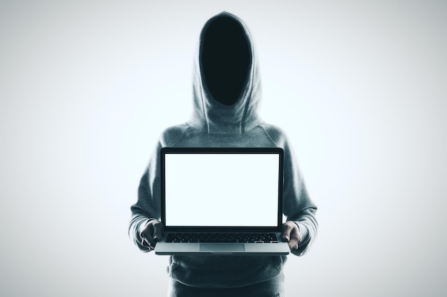 No face hacker and laptop