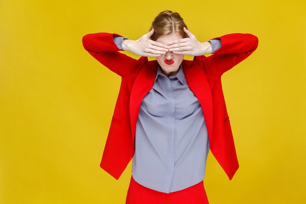 No red hair business woman in red suit closed eyes