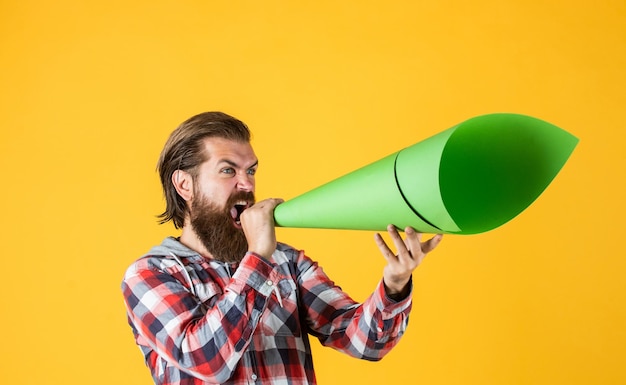 No secrets hipster screaming in the megaphone activist speaks\
at rally make it heard oratory and rhetoric mature crazy mad man\
pose with megaphone announcement concept stop being silent