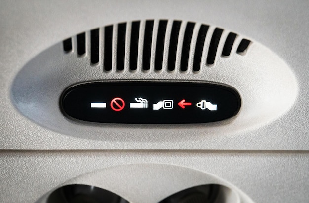 No Smoking and Fasten Seat belt Sign Inside an Airplane