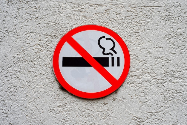 No smoking sign on a cement plaster wall