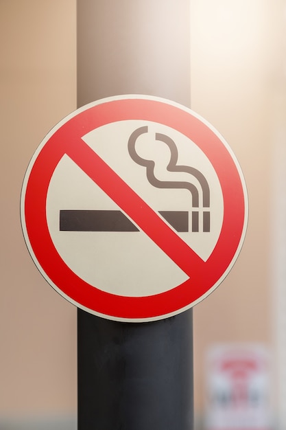 Photo no smoking sign on public place background