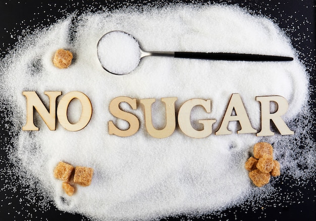 No sugar text from letters and sugar slide on a spoon