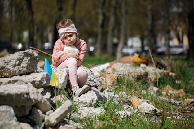 No war in ukraine girl near a destroyed house in ukraine