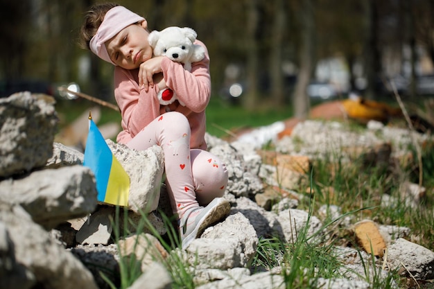 No war in ukraine girl near a destroyed house in ukraine