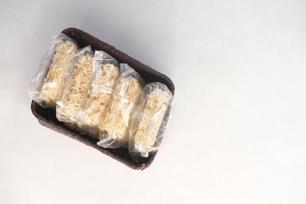 Noddle packet in a box on white background