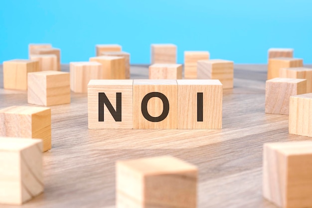 NOI text as symbol on cube wooden blocks