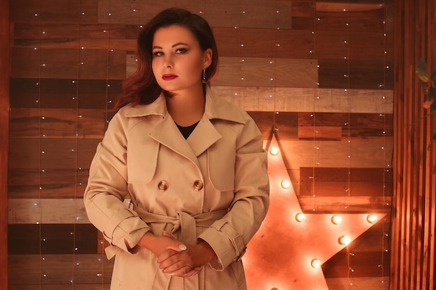 Photo noir style portrait of a young brunette. a young girl dressed as a spy