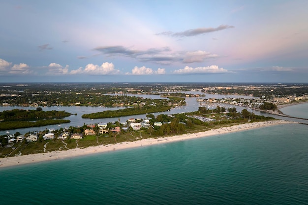 Nokomis beach with soft white sand in Sarasota county USA Many people enjoing vacation time bathing in warm gulf water and tanning under hot Florida sun at sunset