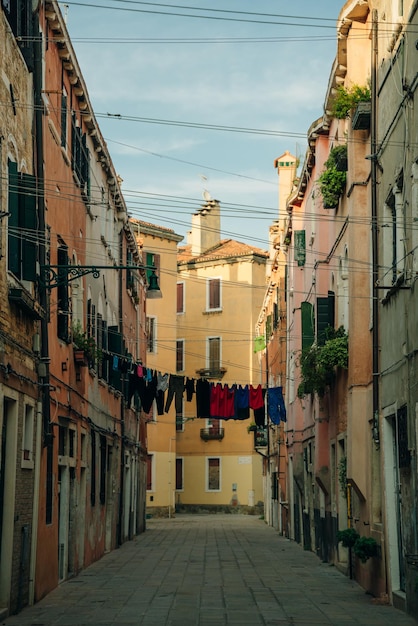 non touristic street in venice italy laundry hanging over the street