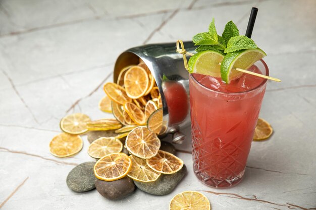 nonalcoholic cocktail lemonade With mint ice lime on a gray table