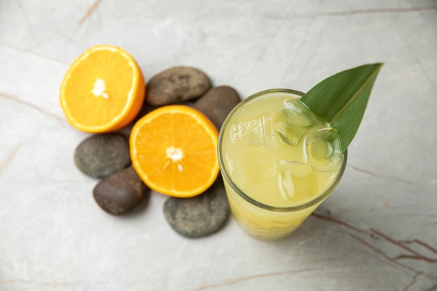 nonalcoholic refreshing cocktail in the heat lemonade With ice on a gray table