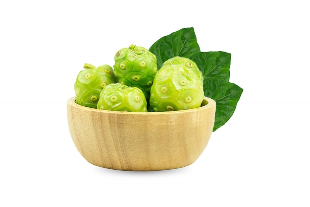 Noni or Morinda Citrifolia and pieces in a wooden cup