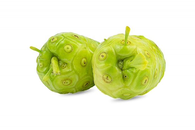 Noni or Morinda Citrifolia and slice isolated on white 