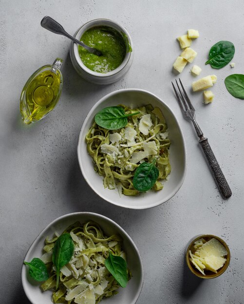 noodles fettuccine with pesto sauce and parmesan