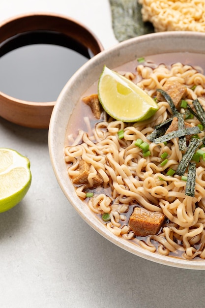 Noodles  ramen with tofu nori and lime