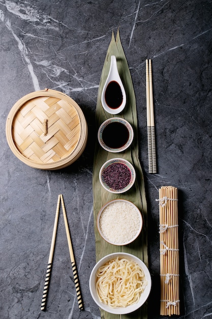 Noodles and rice on bamboo leaves