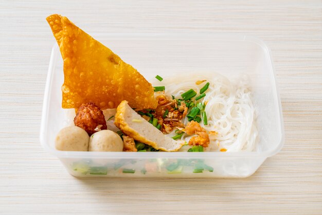 Noodles with fish ball and minced pork in delivery box, asian food style