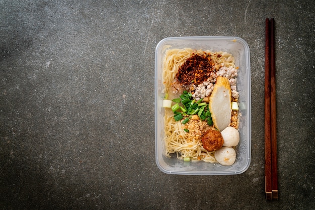 noodles with fish ball and minced pork in delivery box - Asian food style