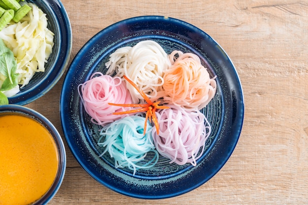 noodles with fish curry sauce and vegetable