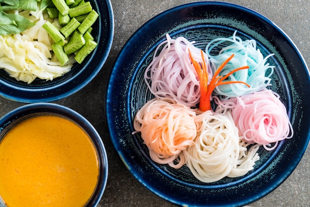 noodles with fish curry sauce and vegetable