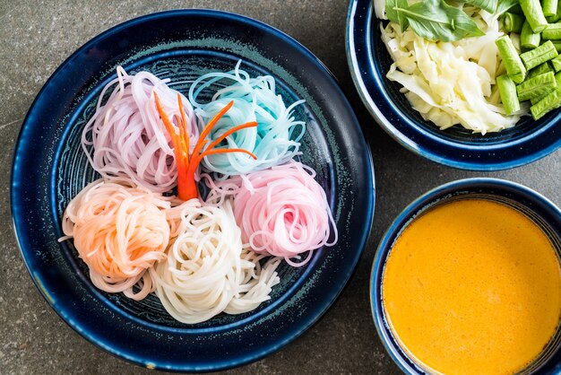 noodles with fish curry sauce and vegetable