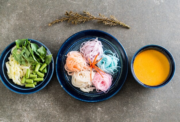 noodles with fish curry sauce and vegetable