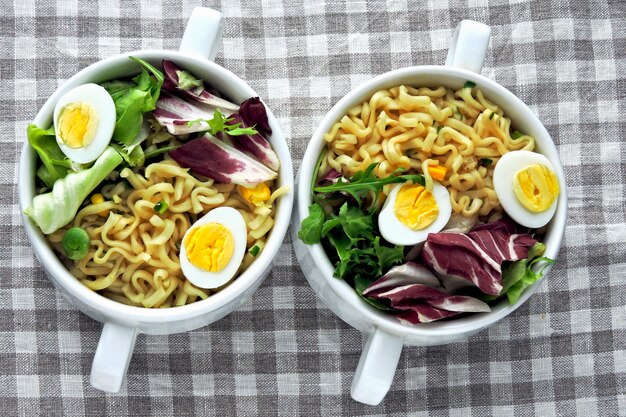 Noodles with salad and quail eggs. Healthy food. Diet food.