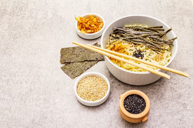 Noodles with seaweed, tuna flakes and sesame seeds