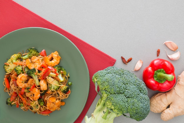 Noodles with shrimps and vegetables in Asian style