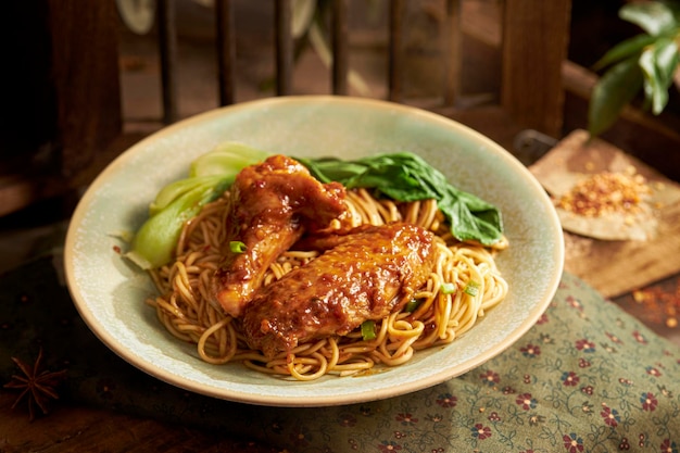 Noodles with thighs and satay chicken wings