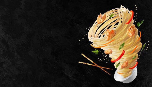 Photo noodles with vegetables and chicken meat in the form of a tornado. wooden sticks and a bowl of noodles, red peppers, carrots, onions and chicken. copy space.
