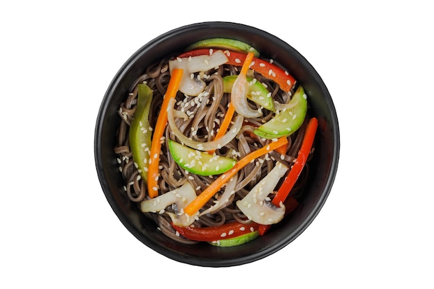 Noodles wok with vegetables herbs and sesame In a black round plate On a white background