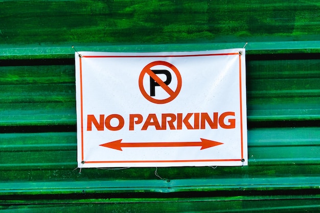 A noparking sign was posted on a wall