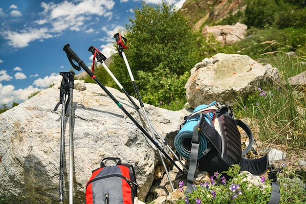 Nordic walking sticks backpacks in the mountains