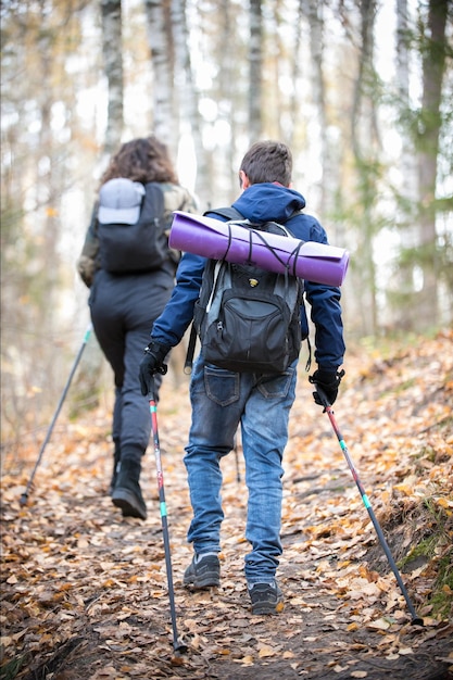 Nordic walking young woman and a child