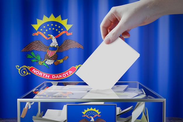North Dakota flag hand drop ballot card into a box 투표 선거 개념 3D 일러스트레이션