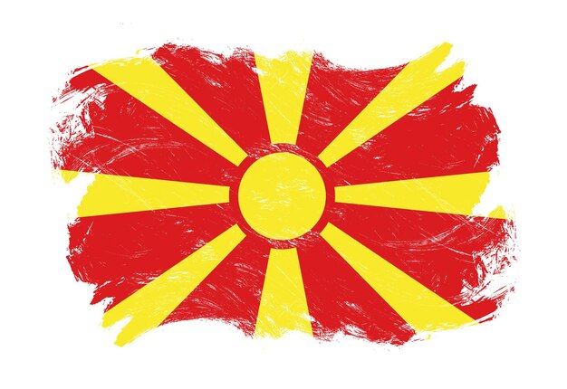 苦しめられたグランジ ホワイト ストローク ブラシの背景に北マケドニアの旗