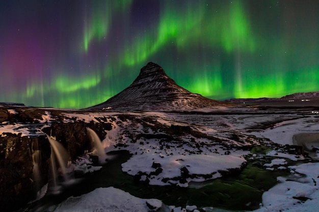 Northern Light Aurora borealis at Kirkjufell in Iceland Kirkjufell mountains in winter