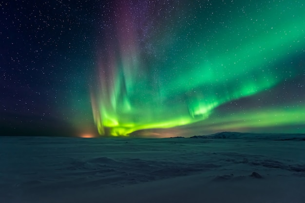 Northern lights aurora borealis over mountains