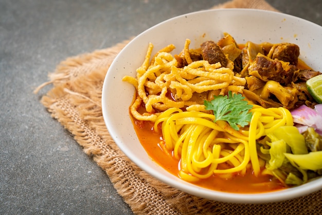 Northern Thai noodle curry soup with braised pork - Thai food style