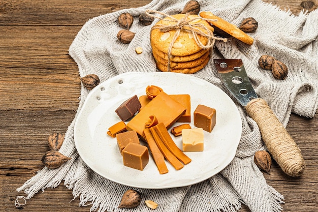 Norwegian brunost with cookies and nuts Healthy food and eating organic ingredient for breakfast